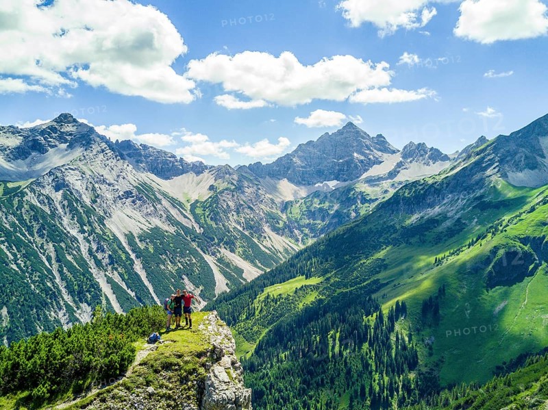 Three hikers in the mountains