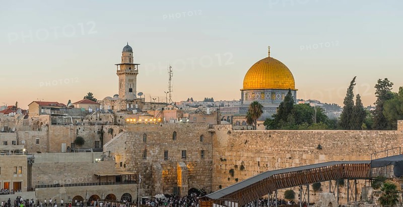 Believers at the Wailing Wall at dusk