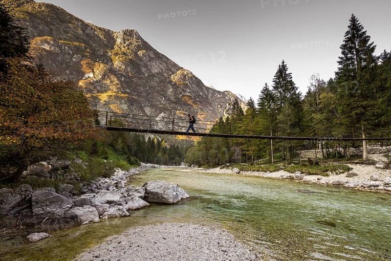 Bridge over Isonzio river in autumn mood in Triglav National Park