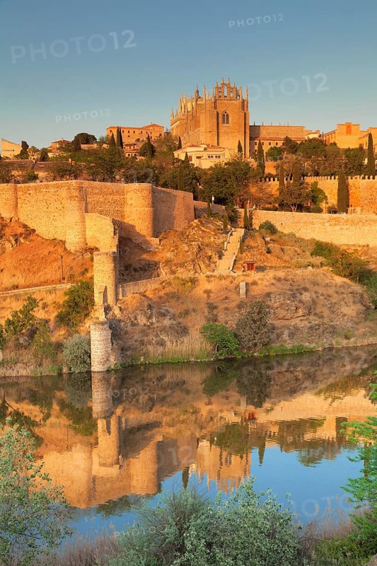 San Juan de los Reyes Church and city wall reflected in the River Tajo river