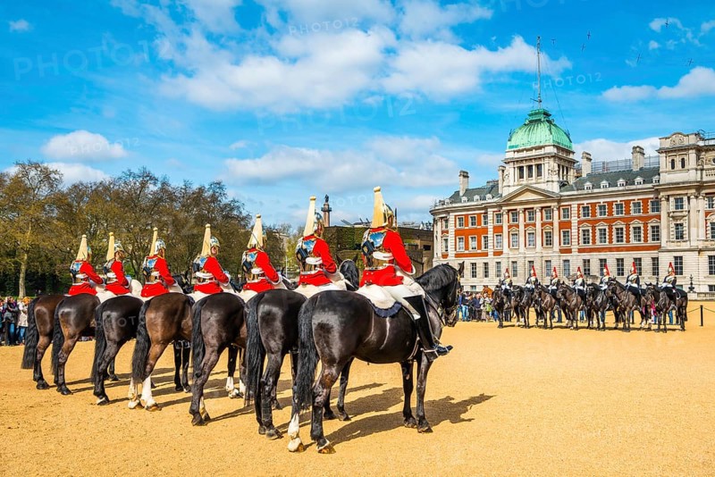 Royal Guards in red uniform on horses