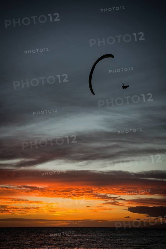 Paraglider at Playa de la Enramada at sunset in Adeje