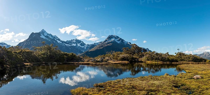 Small mountain lake with reflection