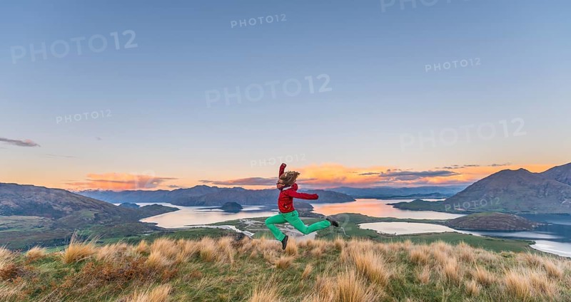 Hiker jumping in the air