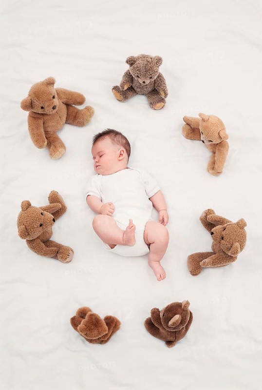 Baby sleeping with teddy bear Austria