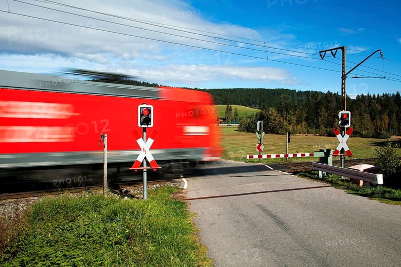 Level crossing with passing train