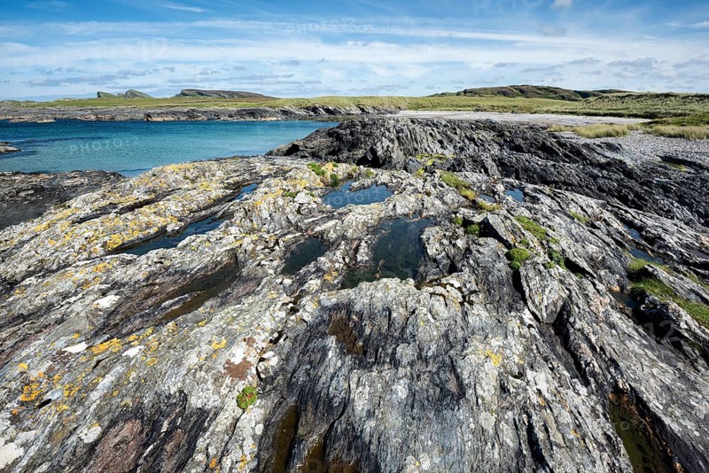 Rugged Slate rocks in the Bay of Saligo