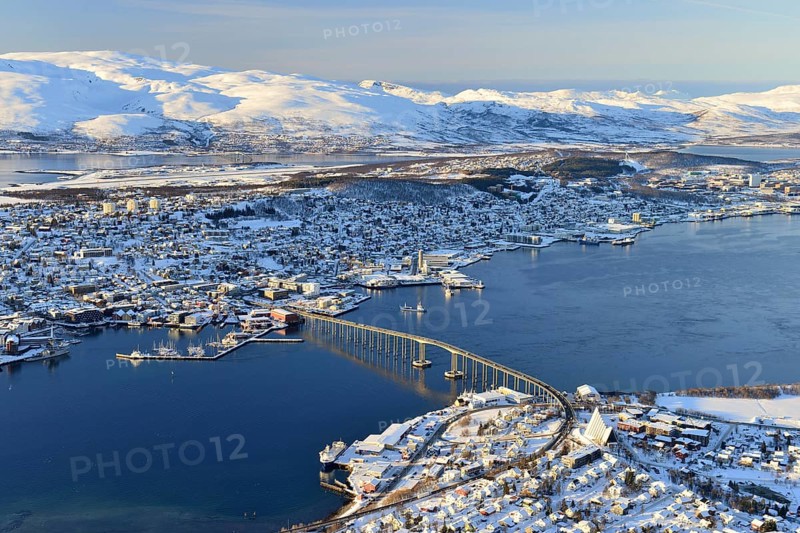 Snowy town with bridge