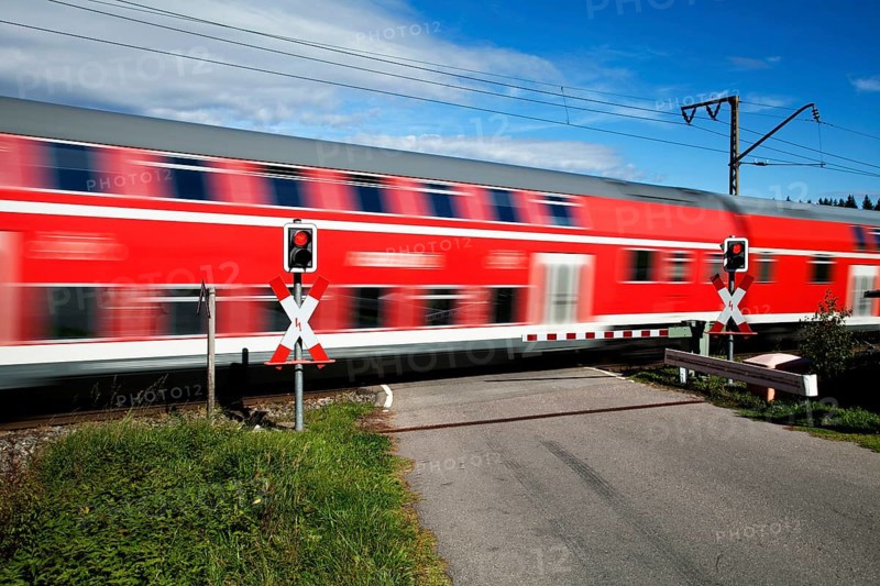 Level crossing with passing train