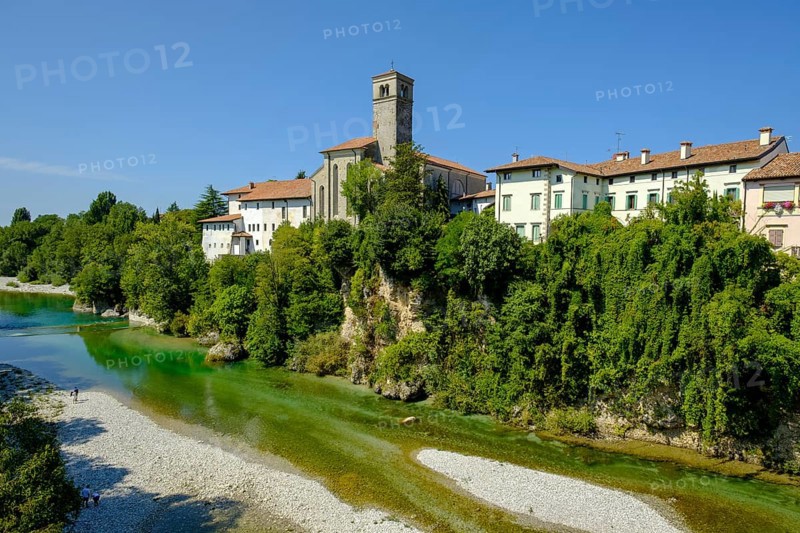 View over the river Natisone to the Campanile of the cathedral Santa Maria Assunta and the old town