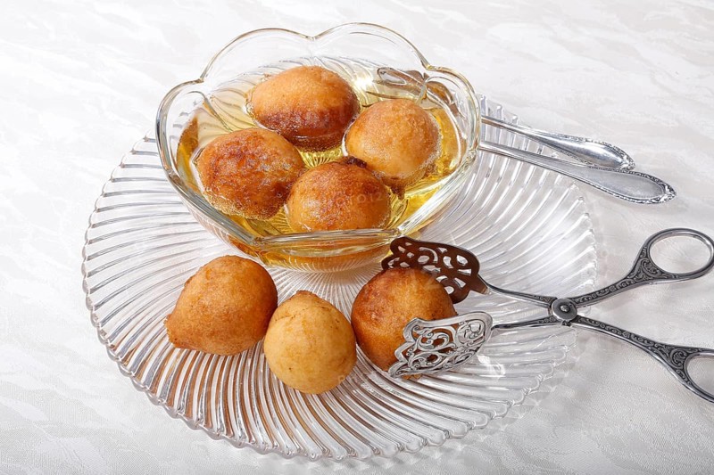 Swabian dessert on glass plate with pastry tongs