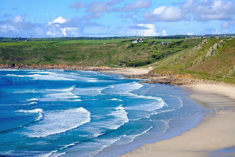 Wide sandy beach with waves