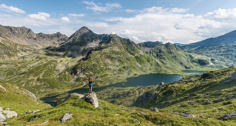 Hiker stretching arms in the air