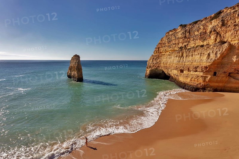 Rock at the sandy beach Praia do Carvalho