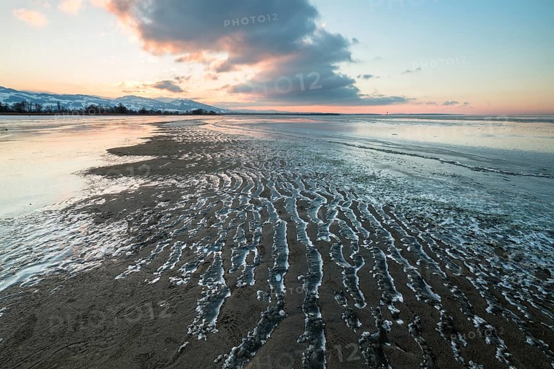 Ice on the shore of Lake Constance on a winter evening