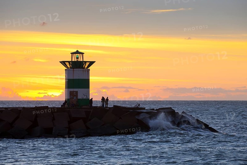 Small lighthouse at harbor entrance