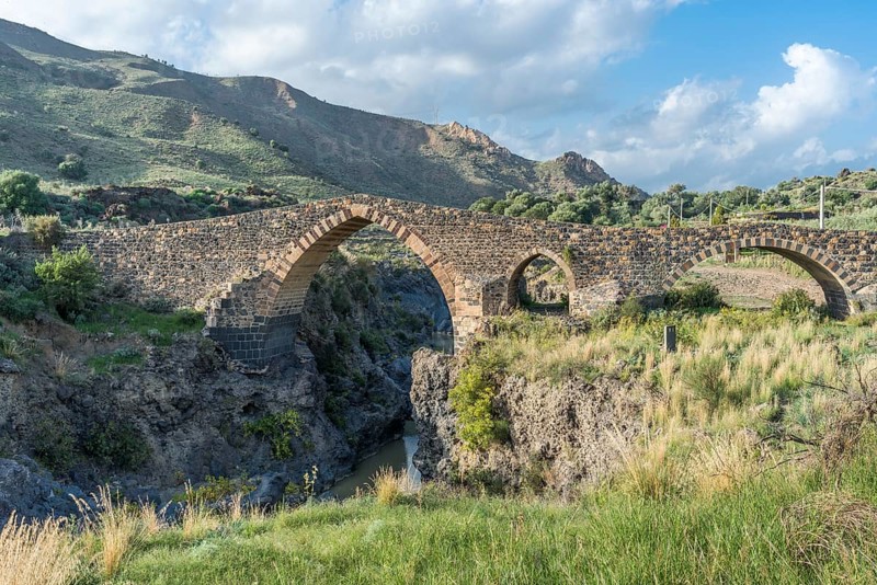 Medieval Saracens bridge crossing the river Simeto