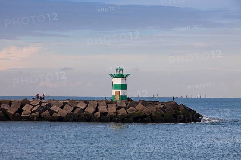 Small lighthouse at harbor entrance