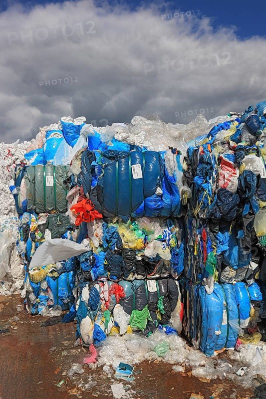Plastic film in bales for recycling in a recycling plant