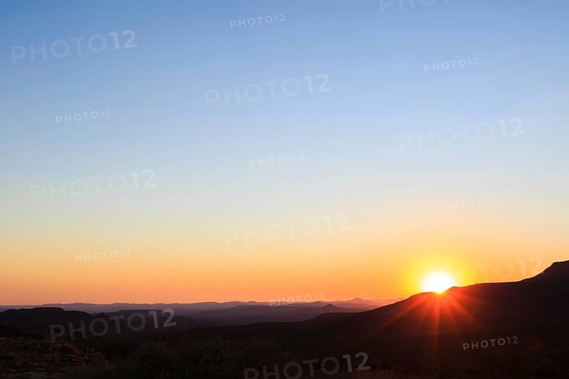 Staggered mountains at sunset