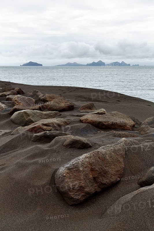 Rock on dune of lava sand
