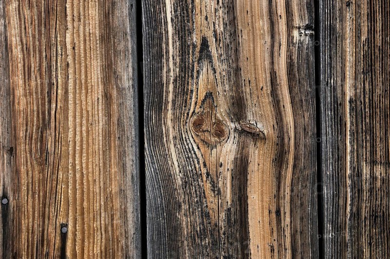 Old weathered wooden boards on wooden wall