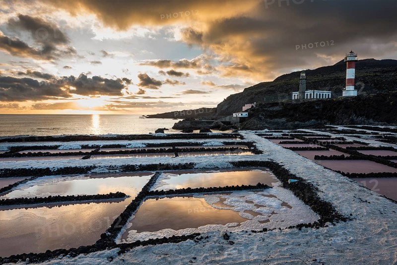 Salinas of Fuencaliente with lighthouse Faro de Fuencaliente at sunset