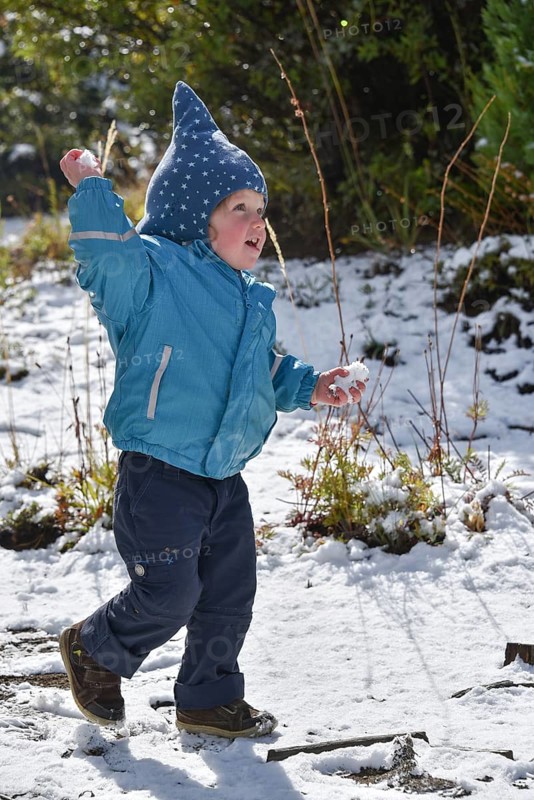 Child at snowball fight