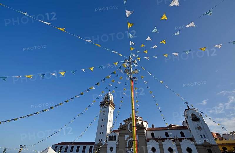Colorful pennants at a festival in front of the Basilica de Nuestra Senora