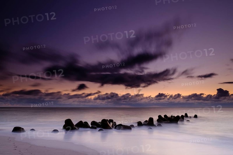 Concrete blocks as coastal protection on the beach of Hornum in the evening light