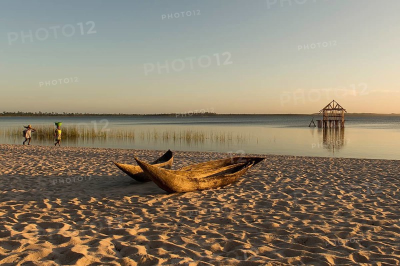 Dugout boat lying on sandy beach