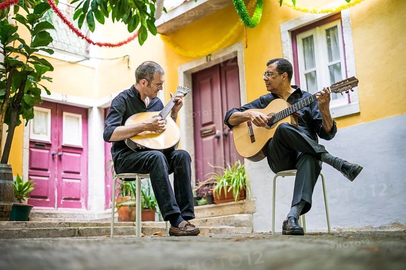 Two fado guitarists with acoustic and portuguese guitars in Alfama