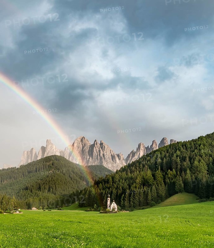 Rainbow in front of the church St. Johann in Ranui