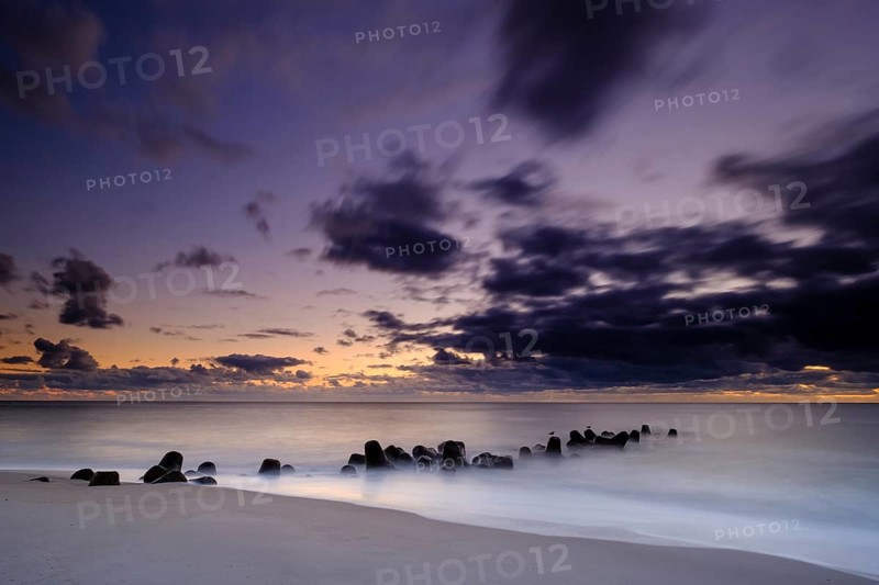 Concrete blocks as coastal protection on the beach of Hornum in the evening light