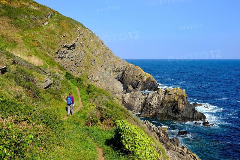 Woman hiking on Coast Path