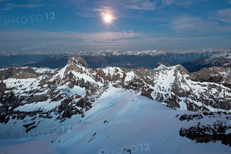 Santis Mountain overlooking Alpstein massif at full moon