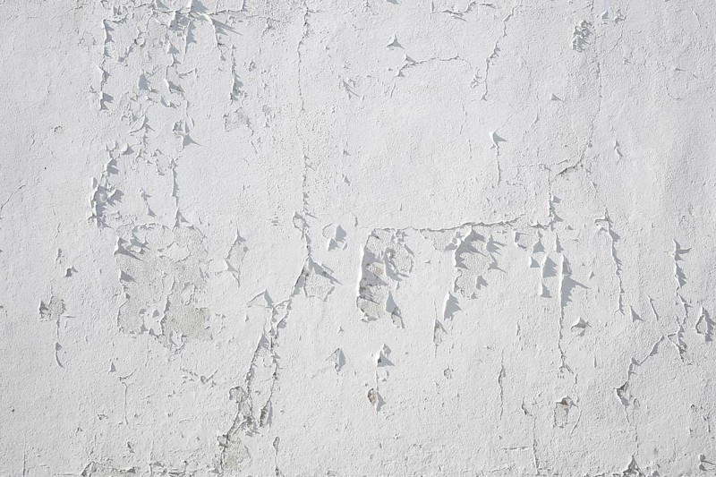 Structure of peeling white wall paint on white wall