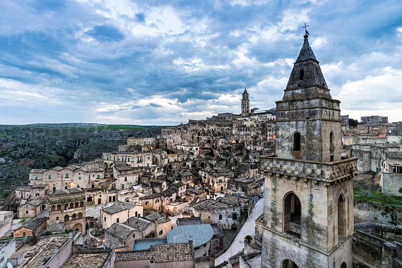 Church tower of San Pietro Barisano in front of the old town with cathedral