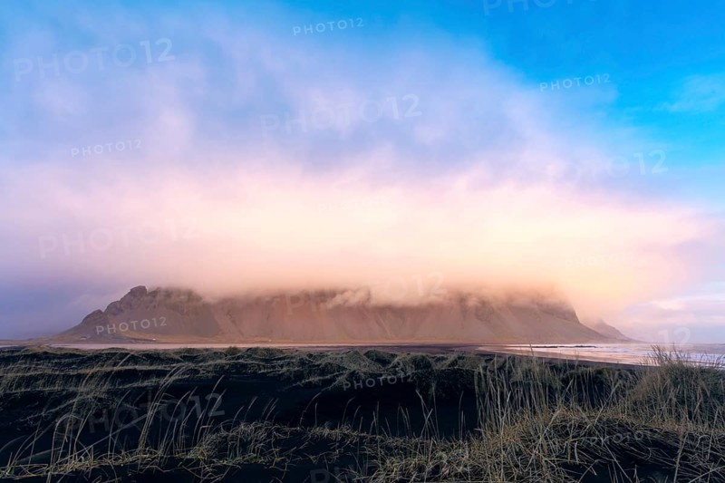 Mountain massif horn in clouds