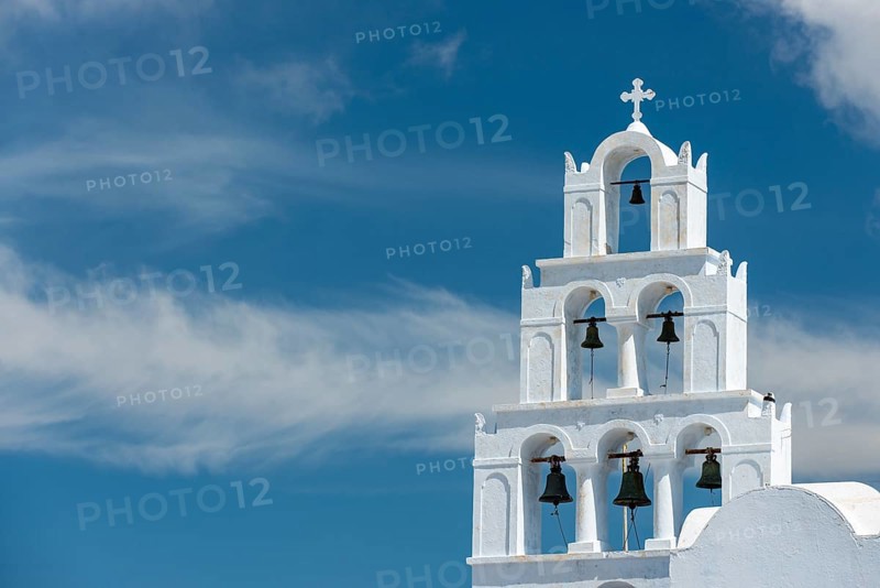 Bell tower in front of cloudy sky