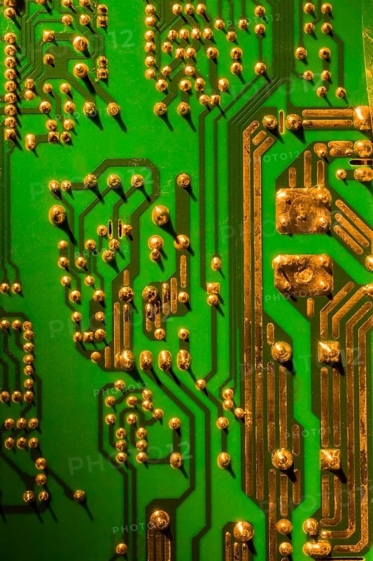 Green and gold computer circuit board close-up