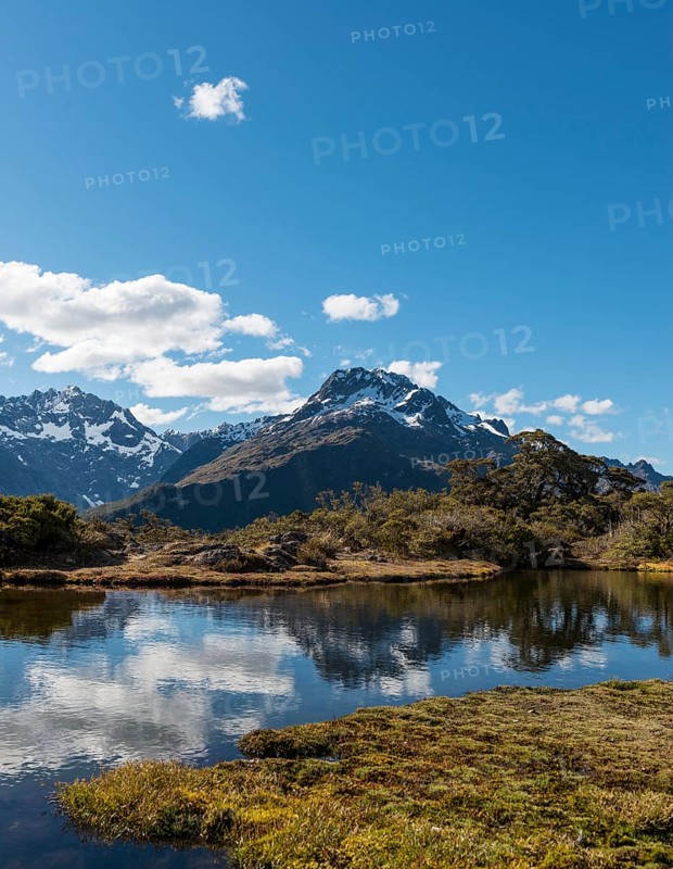 Small mountain lake with reflection