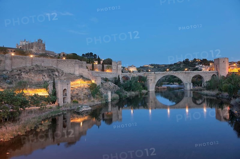 San Juan de los Reyes Church and Puente de San Martin bridge reflected in the Tajo River