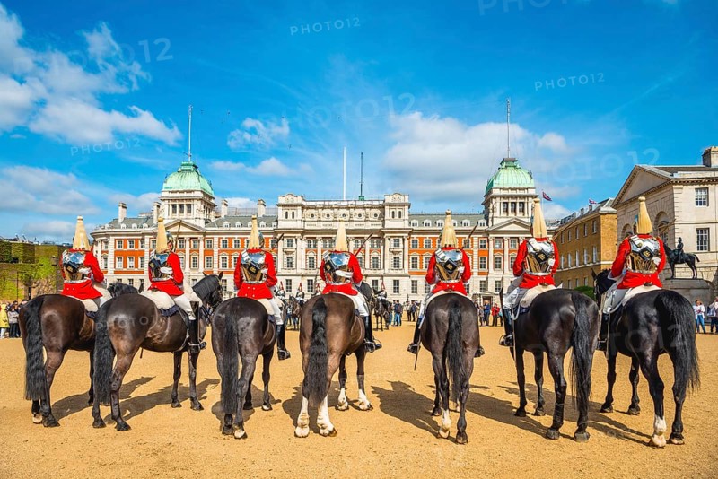 The Royal Guards in red uniform on horses