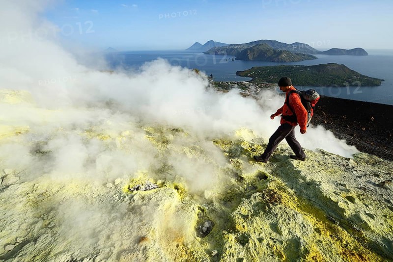 Hiker on the Gran Cratere walks through sulphur fumaroles