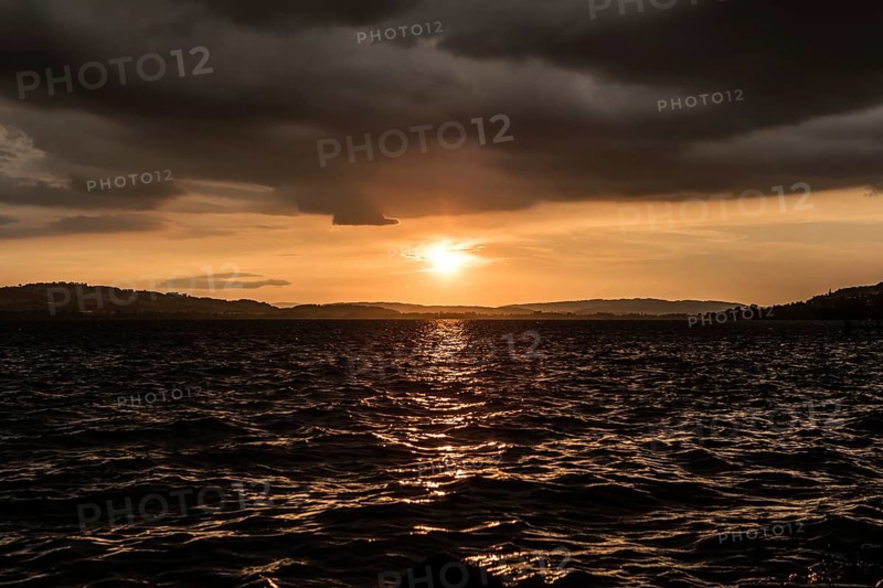 Sunset with clouds and stormy mood