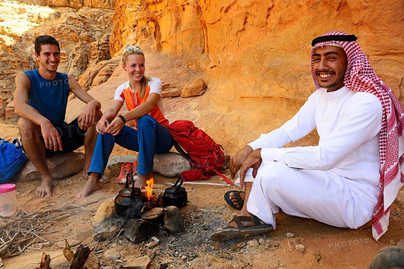 Tourists drink Tea with Bedouin in Wadi Rum