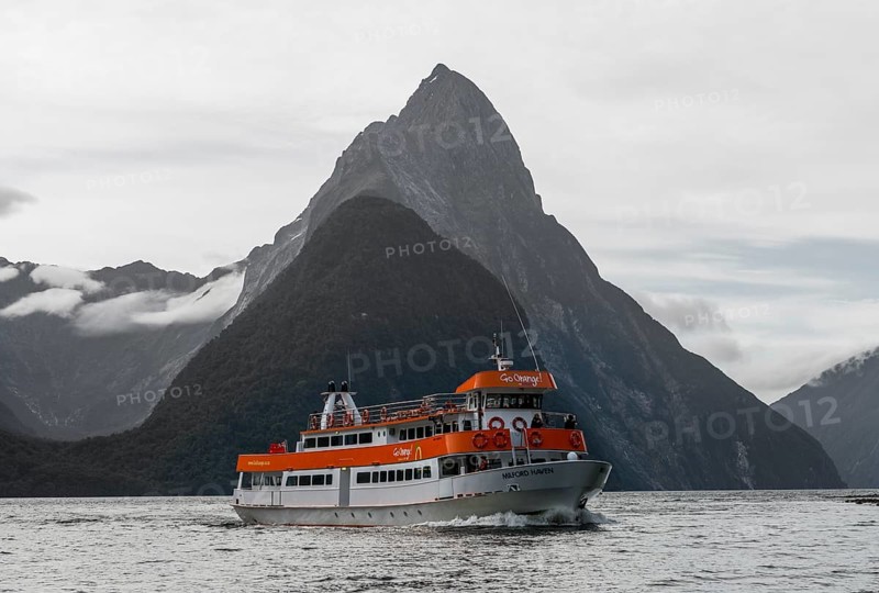 Tourist boat moving through Milford Sound
