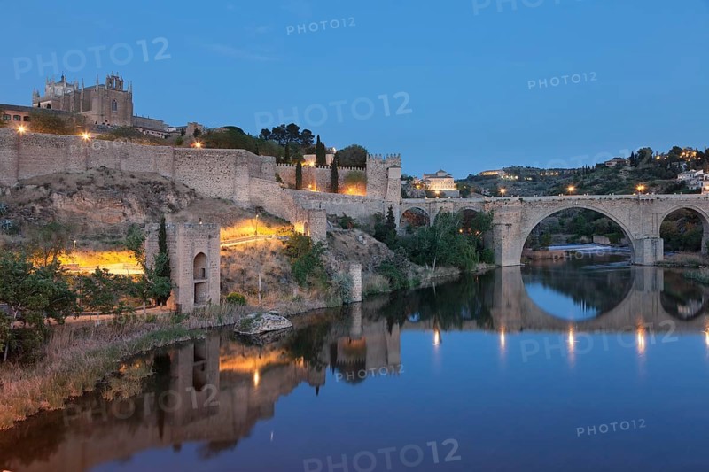 San Juan de los Reyes Church and Puente de San Martin bridge reflected in the Tajo River