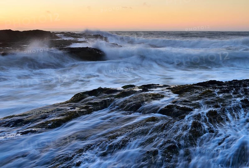Waves breaking on rocks on the coast